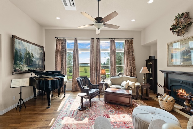 living room featuring ceiling fan and wood-type flooring