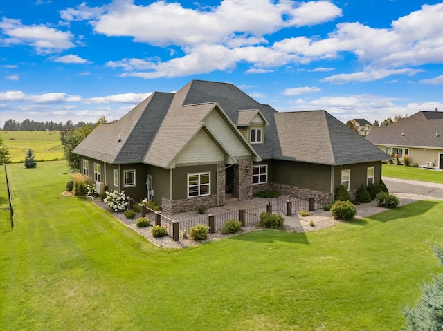 back of house with a lawn