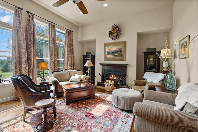 living room featuring ceiling fan and wood-type flooring