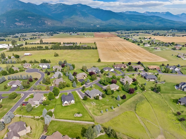 birds eye view of property with a rural view and a mountain view