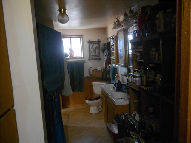 467 Cooper Ln, Hamilton, MT 59840 - bathroom with toilet, vanity, and tile patterned floors