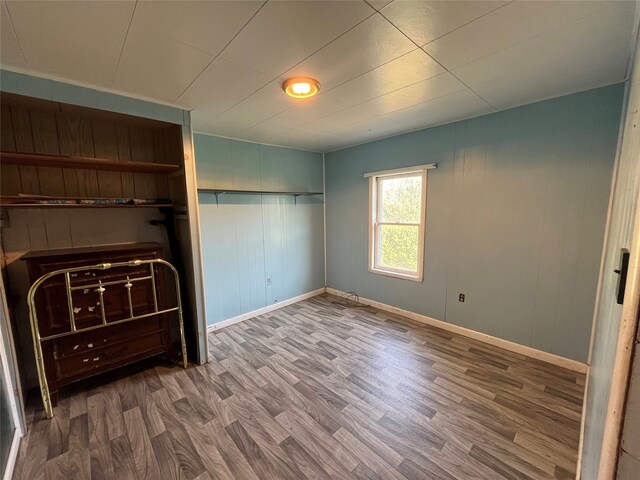 unfurnished bedroom featuring hardwood / wood-style flooring