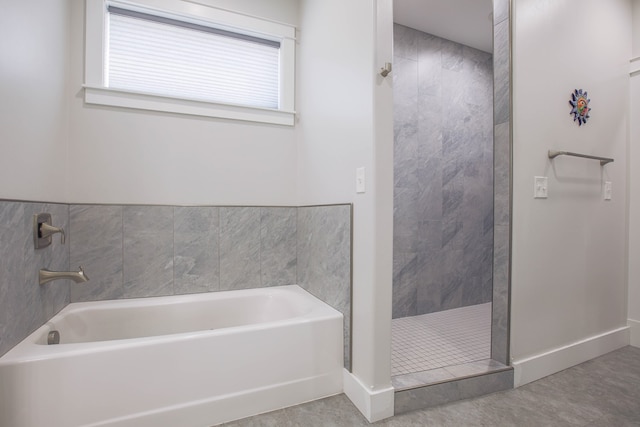 bathroom featuring separate shower and tub