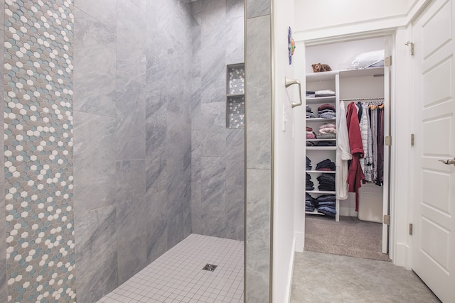 bathroom with a tile shower