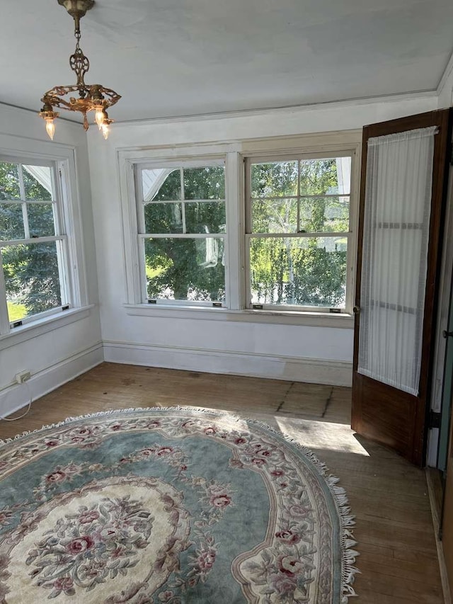 interior space with plenty of natural light and a chandelier