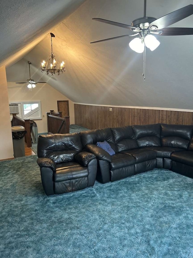 cinema room featuring lofted ceiling, carpet flooring, and ceiling fan with notable chandelier