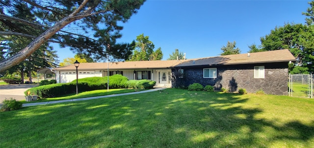 single story home with a front lawn and a garage