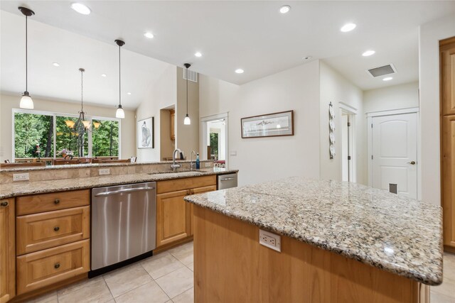 kitchen with light tile patterned floors, stainless steel dishwasher, a center island, sink, and light stone counters