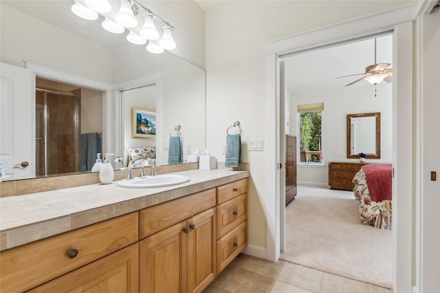 1550 Rolling Ridge Loop, Kalispell, MT 59901 - full bath with connected bathroom, vanity, tile patterned flooring, an enclosed shower, and a ceiling fan