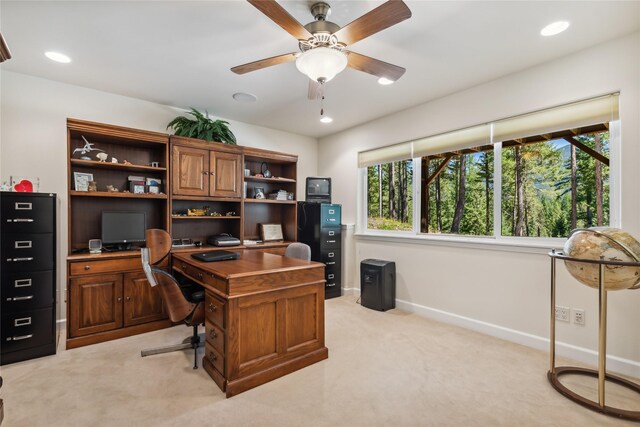 home office with light colored carpet and ceiling fan