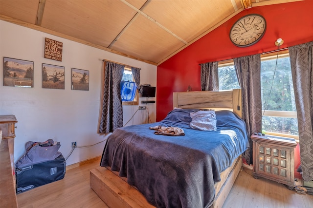 bedroom with wood ceiling, lofted ceiling, and light wood-type flooring