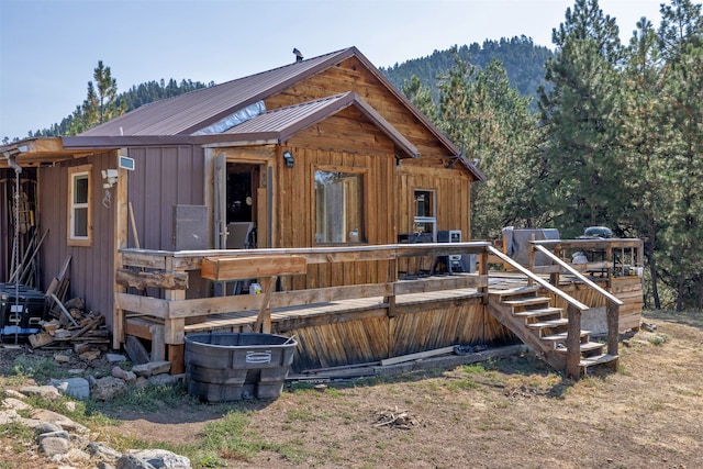 back of house with a mountain view