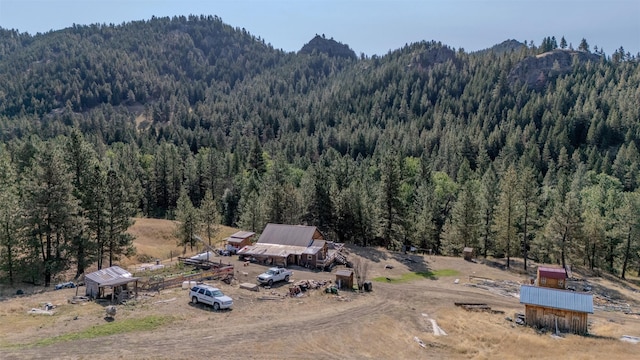 4636 N Fork Rd, Cascade, MT 59421 - drone / aerial view of a heavily wooded area and a mountainous background