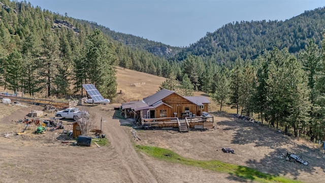 birds eye view of property featuring a mountain view and a rural view