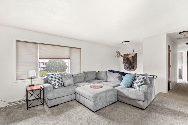 carpeted living room featuring visible vents