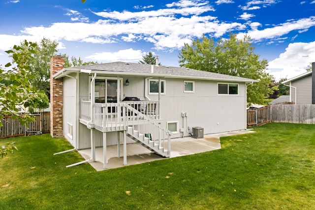 back of house featuring a yard, cooling unit, a fenced backyard, and a patio