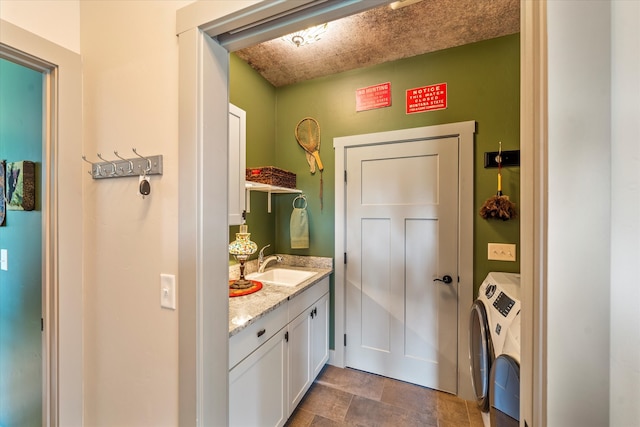 bathroom featuring vanity and separate washer and dryer