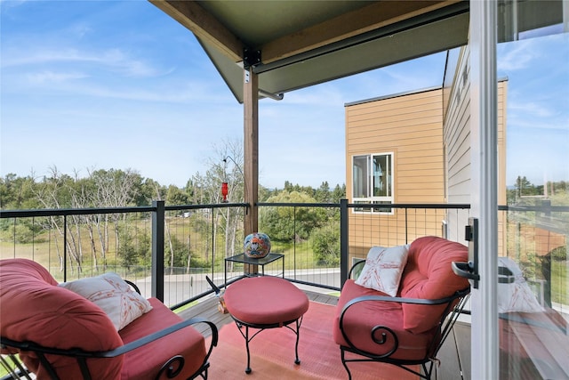 balcony featuring a sunroom