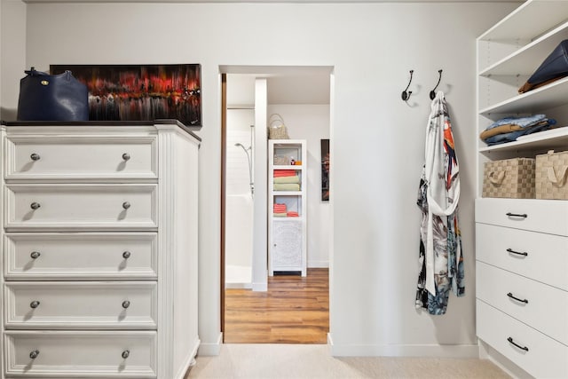 walk in closet featuring light wood-style floors