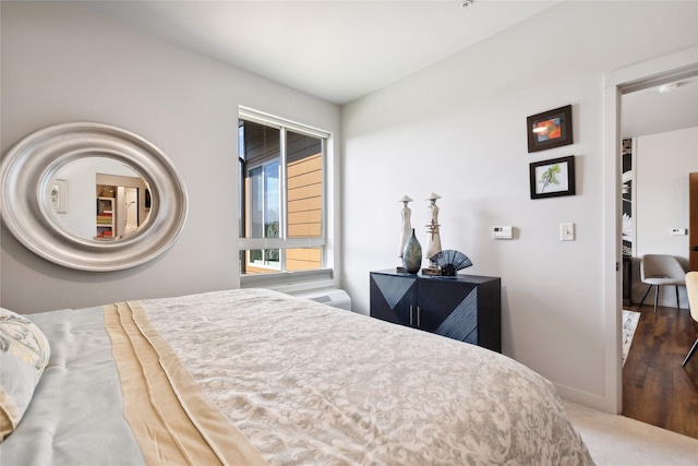 bedroom featuring carpet floors and baseboards