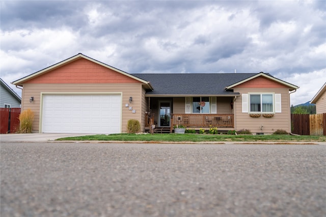 ranch-style house with a garage and a porch