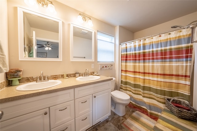 bathroom featuring vanity, toilet, a shower with curtain, tile patterned floors, and ceiling fan