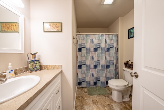 bathroom with a shower with shower curtain, tile patterned flooring, toilet, and vanity