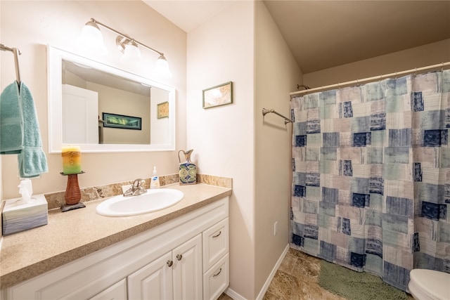 bathroom with tile patterned flooring, vanity, toilet, and a shower with shower curtain