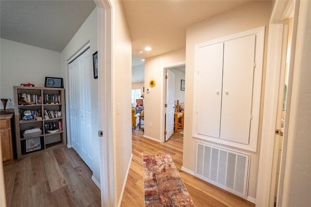 corridor featuring light hardwood / wood-style floors