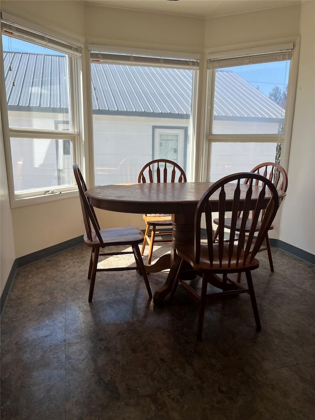 dining area featuring baseboards