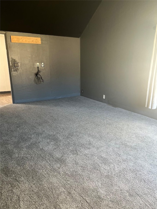 214 3rd St SW, Cut Bank, MT 59427 - unfurnished room with carpet flooring and vaulted ceiling