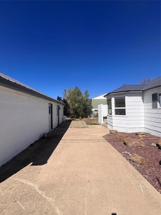 exterior space featuring metal roof