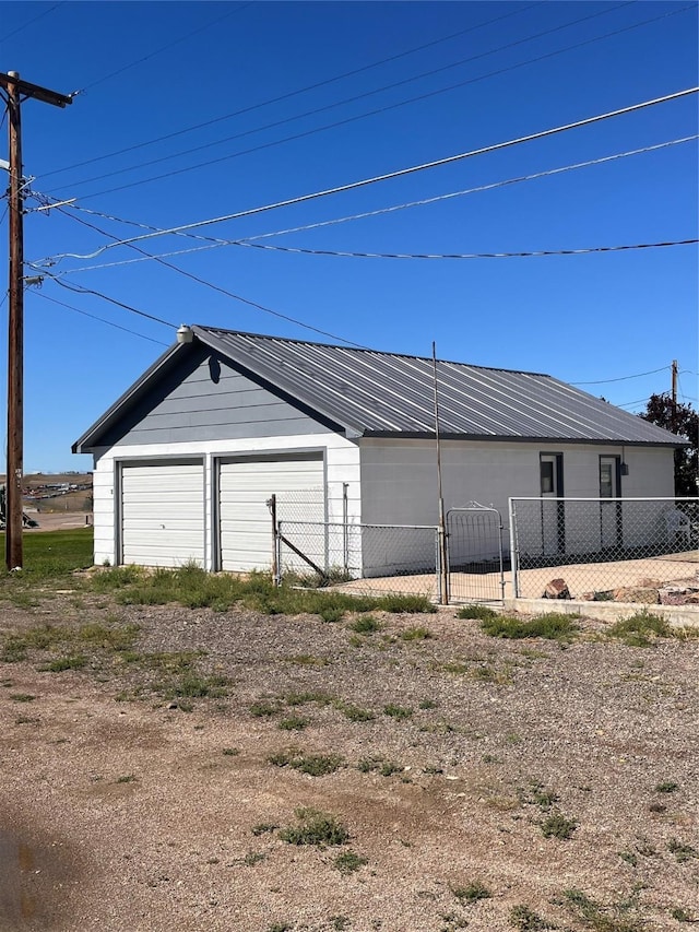 detached garage with fence