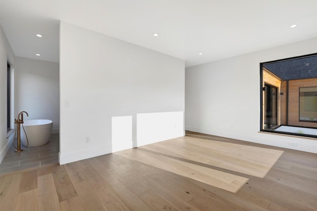 unfurnished room featuring light wood-type flooring