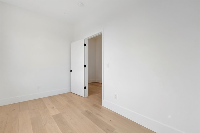 unfurnished room with light wood-type flooring