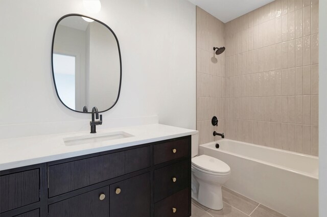 full bathroom featuring tile patterned floors, vanity, toilet, and tiled shower / bath