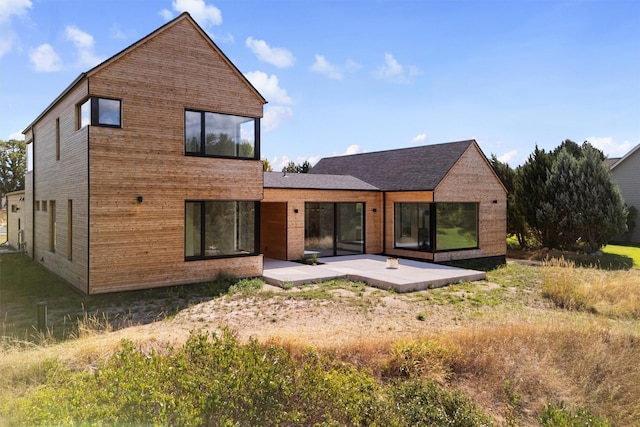 rear view of property featuring a patio