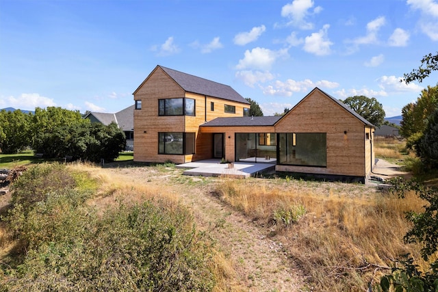 rear view of property with a patio area