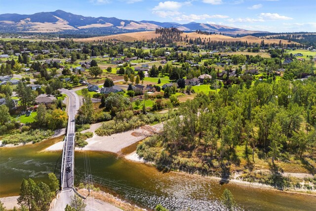 birds eye view of property featuring a water and mountain view