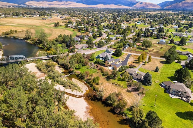 drone / aerial view with a water and mountain view