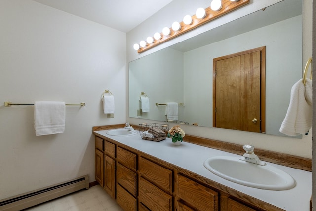 full bathroom featuring baseboard heating, double vanity, and tile patterned floors
