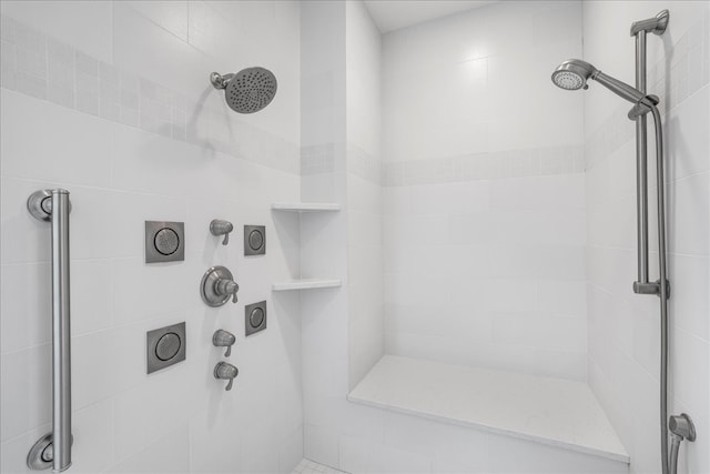 bathroom with a tile shower