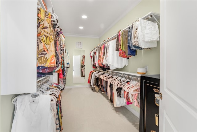 walk in closet featuring carpet floors