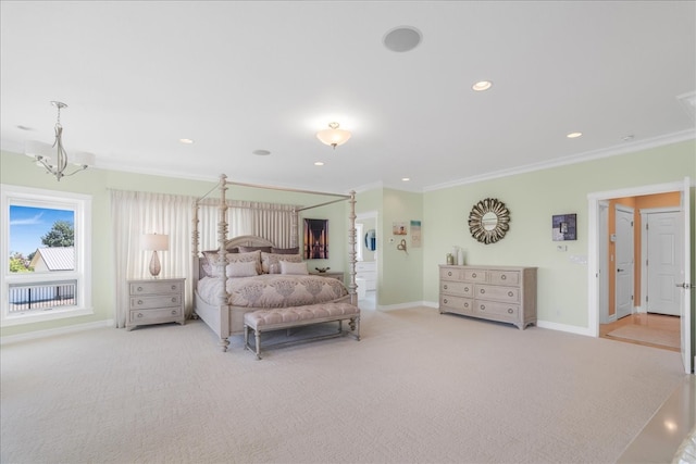 carpeted bedroom featuring crown molding and a notable chandelier