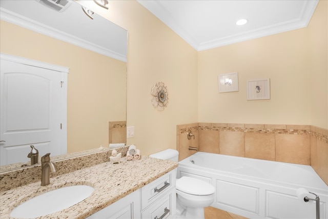 bathroom featuring crown molding, vanity, toilet, and a bathing tub