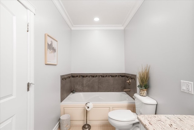 bathroom featuring a tub, toilet, crown molding, and vanity