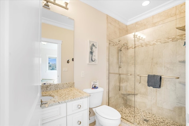 bathroom with toilet, a shower with door, crown molding, and vanity