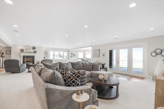 carpeted living room with crown molding