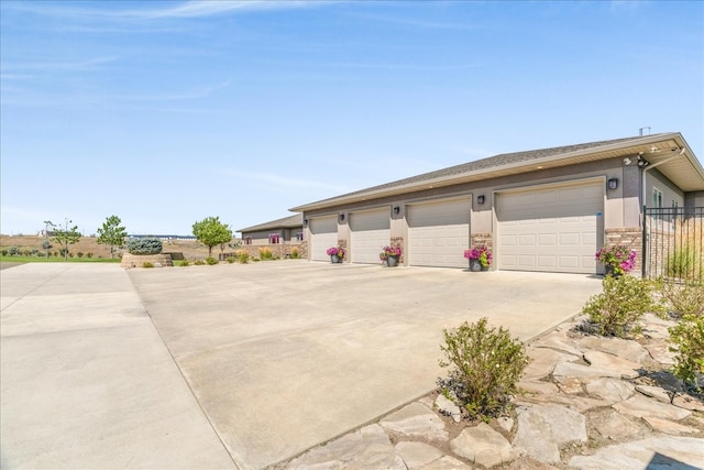 ranch-style house featuring a garage