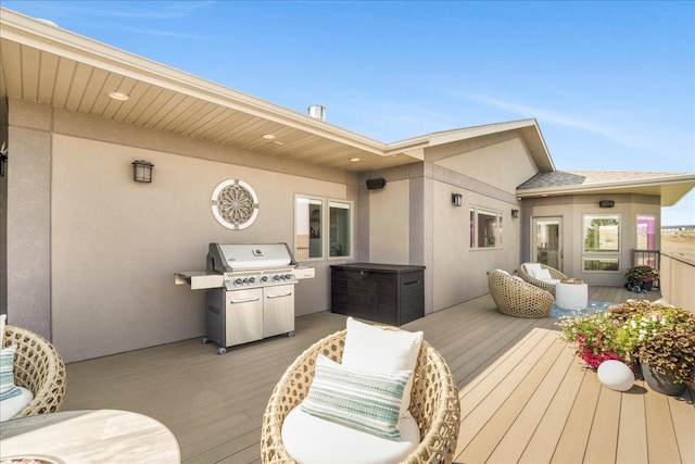 wooden deck featuring grilling area